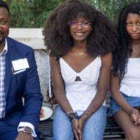 faculty and family sitting together